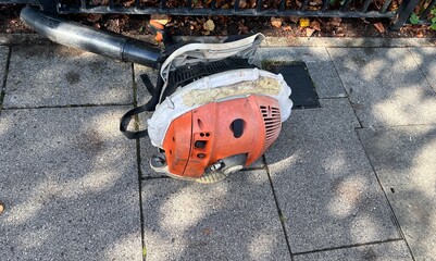 A professional leaf blower used to tidy up leaves and weeds after gardening, pruning, hedge trimming and raking. Powered by a petrol engine and worn like a rucksack.