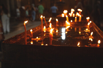 Burning candles in a church.