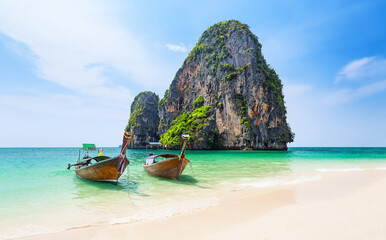 Panoramic view of Ao Phra Nang Beach with thai traditional wooden longtail boat, white sand and turquoise water in Krabi province. Ao Nang, Thailand.