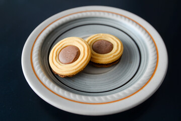 On the tray is a biscuit with hard and creamy chocolate, popularly called noblice