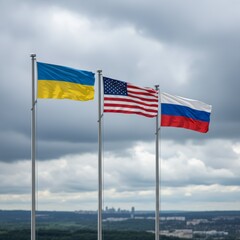 The flags of Ukraine the United States and Russia fly under a stormy sky