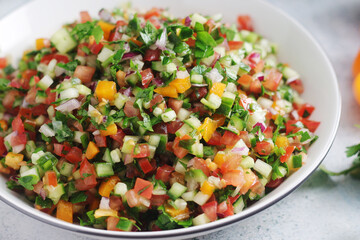 A bowl with traditional Israeli Salad