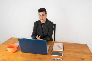 Serious businesswoman attending an important online meeting
