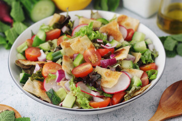 A bowl with Fattoush - Traditional Levantine salad