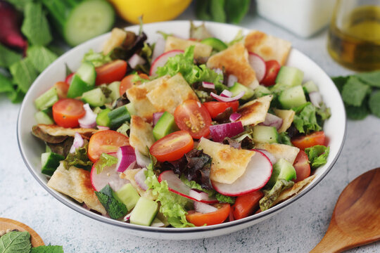 A bowl with Fattoush - Traditional Levantine salad