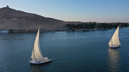 Fototapeta premium Aerial shot of the Nile River with sailboats in Aswan, Egypt
