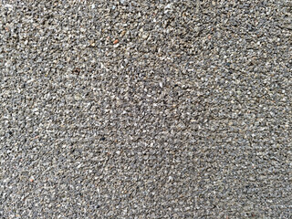 Closeup of small gray gravel stones used for construction and landscaping texture background