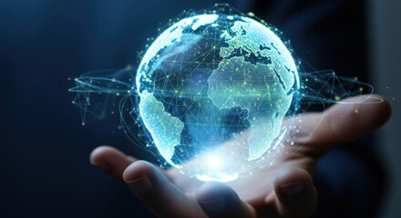 A hand holds a glowing, digital representation of Earth, showcasing interconnectedness and global technology.