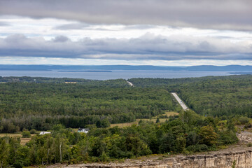 A picturesque view of the Cup and Saucer Trail on Manitoulin Island, showcasing the natural beauty and lush greenery of Ontario's iconic hiking destination.