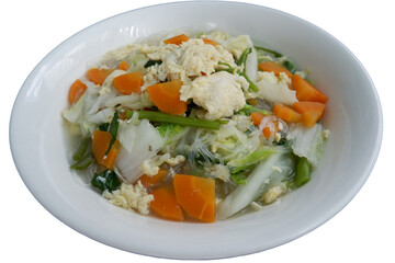 A delicious vegetarian sukiyaki simmers with vibrant carrot cabbage and egg creating heartwarming and comforting culinary experience