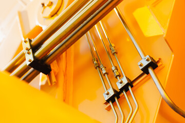 Close-up of hydraulic pipes in industrial mining equipment machinery