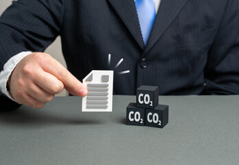 A document limiting carbon dioxide emissions into the atmosphere. Greenhouse gas emission quotas. Concept of climate policy, sustainability and environmental law. Useful for research and reports.