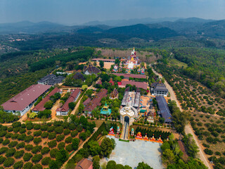 Aerial view of wat sang kaew phothiyan in chiang mai, Thailand amidst verdant landscape