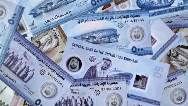 UAE money, dirhams, cash arabic banknotes for financial and business processes. Emirates cash as a financial background for your design