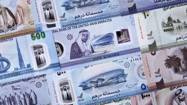 UAE money, dirhams, cash arabic banknotes for financial and business processes. Emirates cash as a financial background for your design