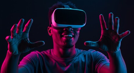 Man wearing virtual reality headset smiling with hands raised