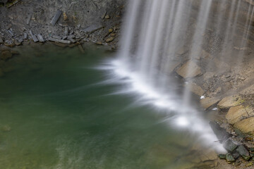 Bridal Veil Falls on Manitoulin Island offers a serene and picturesque glimpse into Ontario's natural beauty with its cascading waters and lush surroundings.