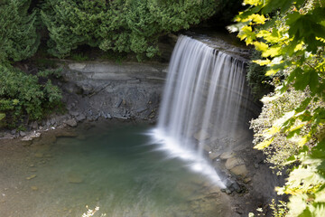 Bridal Veil Falls on Manitoulin Island offers a serene and picturesque glimpse into Ontario's natural beauty with its cascading waters and lush surroundings.