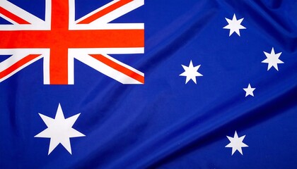 Close-up view of the Australian flag, displaying vibrant blue, red, and white colors, with a Union Jack in the upper left corner and a constellation of five-pointed stars.