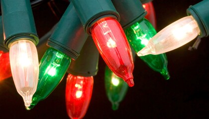 Close-up view of a cluster of colorful Christmas lights, showcasing warm incandescent glows and vibrant hues of red, green, and white.