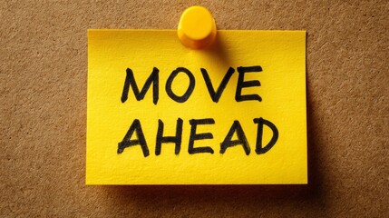 Yellow note with inspirational message on corkboard background