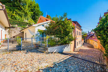 Charming old cobbled stone street in the historic old town of Ptuj, Slovenia