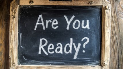 Fototapeta premium Chalkboard sign with motivational message 'are you ready?' in rustic frame