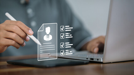 Digital Resume Checklist on Tablet with Stylus and Laptop
