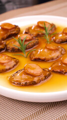 Fried Abalone Slices in Sauce with Green Herbs - Gourmet Asian Seafood Dish