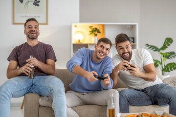 Friends enjoying a game night at home with snacks and drinks in a cozy living room setting