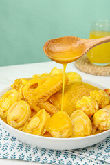 Golden Honey Drizzle Over Fresh Pastries with Wooden Spoon Food Photography