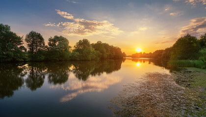 Serene River Sunset With Glowing Sky Lush Trees And Peaceful Reflections On Water Perfect For Relaxation Themes Generative Ai