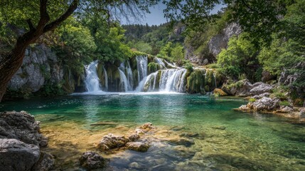 Fototapeta premium Tranquil waterfall and lush forest surrounding crystal clear lake