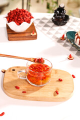 Red Dried Chinese Wolfberry Goji Berries in Glass Cup Traditional Superfood Ingredient