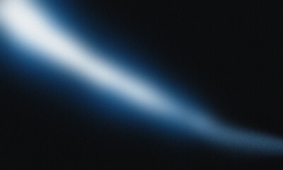 A diagonal beam of white light shining against a dark blue and black gradient background with blur effect