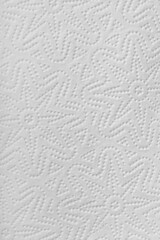 Texture of white paper towel with 3D texture in the shape of stars. Macro.