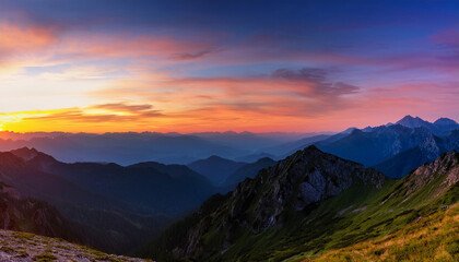 Spectacular Panoramic Landscape Of Mountain Ranges At Sunset With Dynamic Sky Illumination And Color Gradient