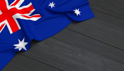 A dramatic representation of the Australian flag draped elegantly over a dark wooden surface.