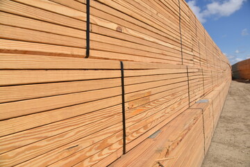 Stack of wood roof trusses at jobsite to be used for construction.
