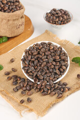 Fresh Pine Nuts in Bowls and Burlap Sack - Wild Harvest Natural Cooking Ingredients on Rustic Wood Surface