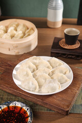 Traditional Handmade Seafood Dumplings with Mackerel Filling and Bamboo Steamer