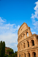 View of the Roman Colosseum in Rome at sunset.