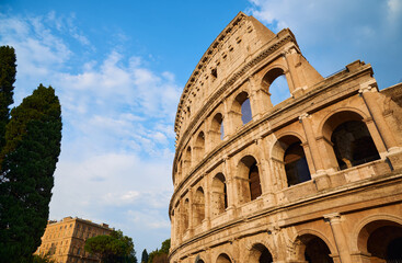View of the Roman Colosseum in Rome at sunset.