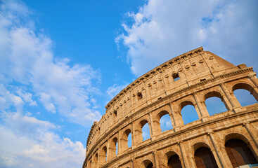 View of the Roman Colosseum in Rome at sunset.