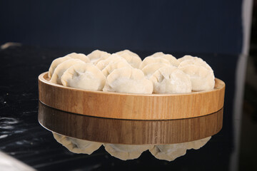 Traditional Spanish Mackerel Dumplings in Wooden Steamer Basket - Handmade Seafood Cuisine