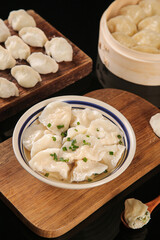 Traditional Handmade Seafood Dumplings with Chives in Steamer Basket - Asian Cuisine Delicacy