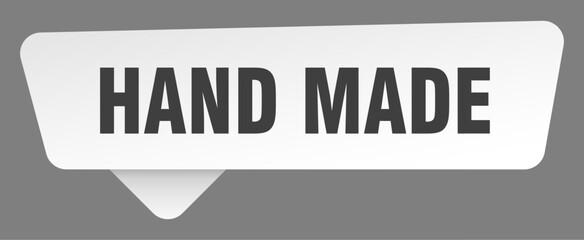 hand made sign. hand made white sticker isolated on gray background