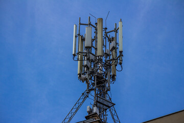 Telecommunication antenna tower with multiple transmitters