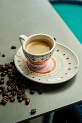small cup of espresso on saucer