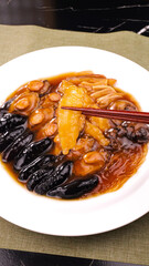 Fresh Abalone and Sea Cucumber Seafood Dish from Dalian China with Golden Sauce
